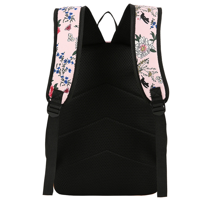 Black backpack with floral straps on a white background