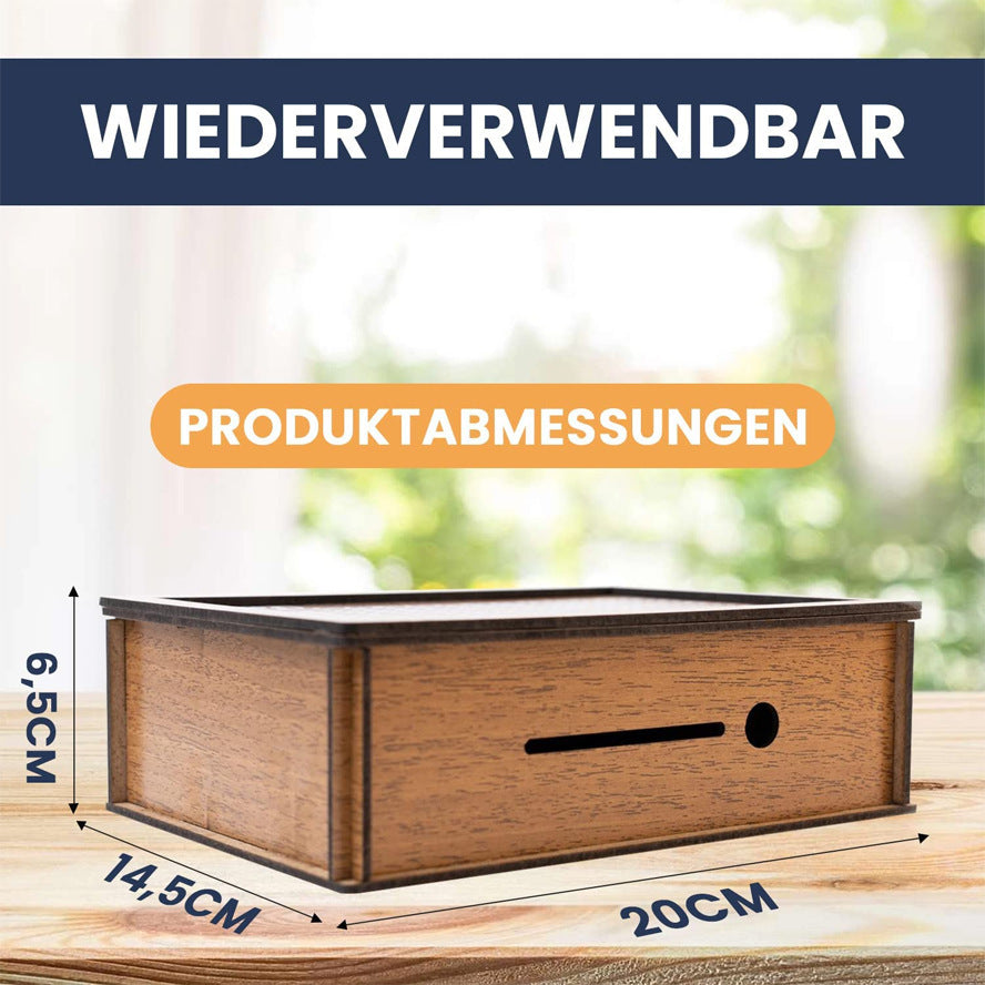 Wooden box with dimensions labeled on a blurred natural background