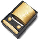 Gold tie, cufflinks, and pocket square set in a black box on a white background