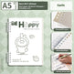 Notebook with cartoon character design on a green checkered background
