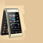Flip phone with clock display on a beige background