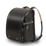 Black leather backpack with visible stitching on a white background