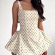 Women's white polka dot strapless mini dress front view
