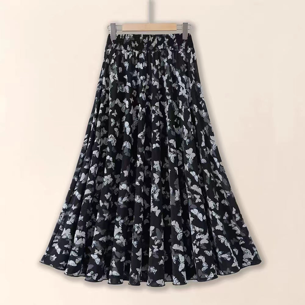 Black floral patterned skirt on a beige background