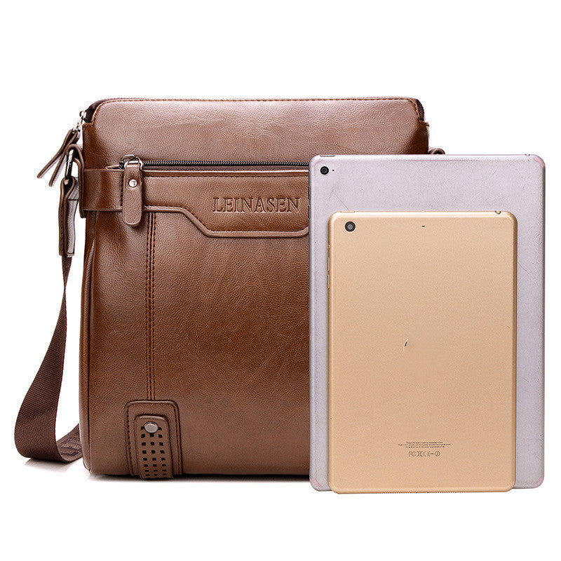 Brown leather bag with 'LEINASEN' branding next to two tablets on a white background