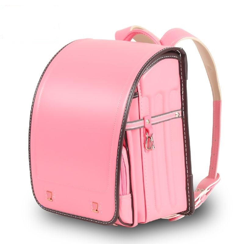 Pink backpack with a strap on a white background