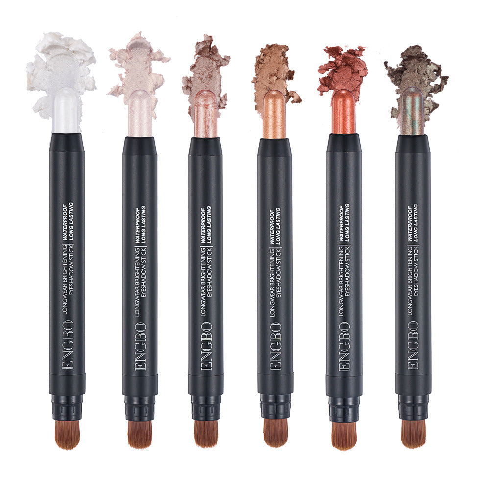 Set of six cosmetic pencils with decorative tips on a white background