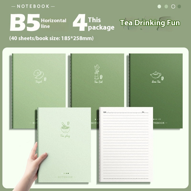 Set of green notebooks with tea-themed designs and a hand holding one of them.