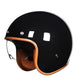 Black motorcycle helmet with brown leather chin strap on a white background