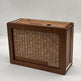 Wooden box with a printed grid and monetary value on a white background