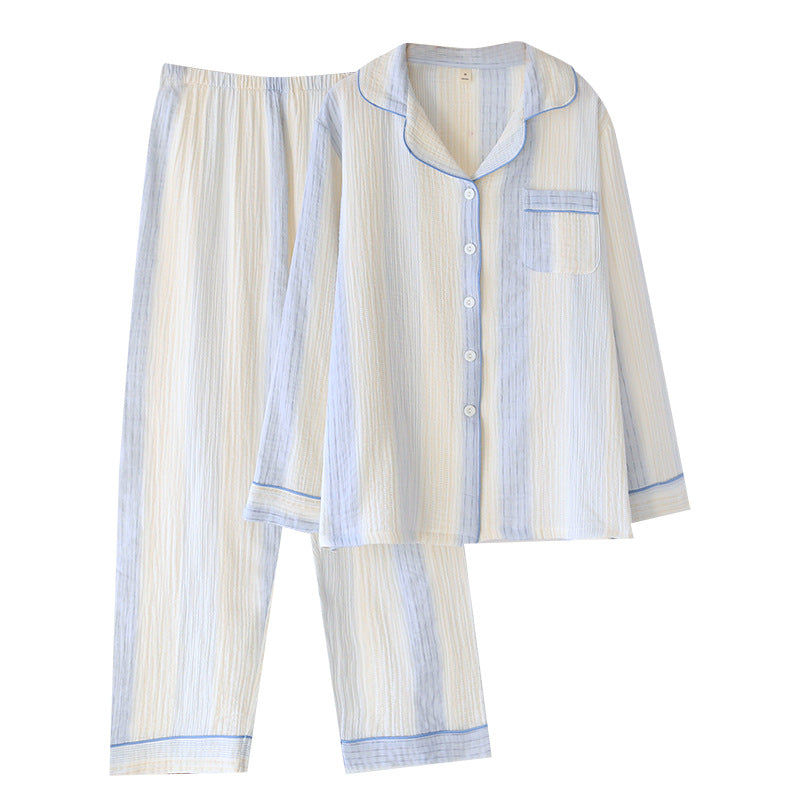 A two-piece pajama set featuring a long-sleeve button-up shirt and matching pants in a cream and light blue striped fabric, displayed against a solid white background.