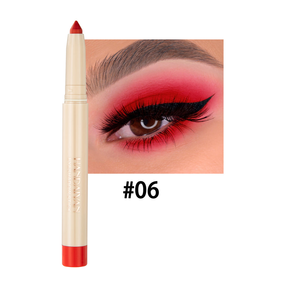 Eyeliner pencil with red color swatch on a white background