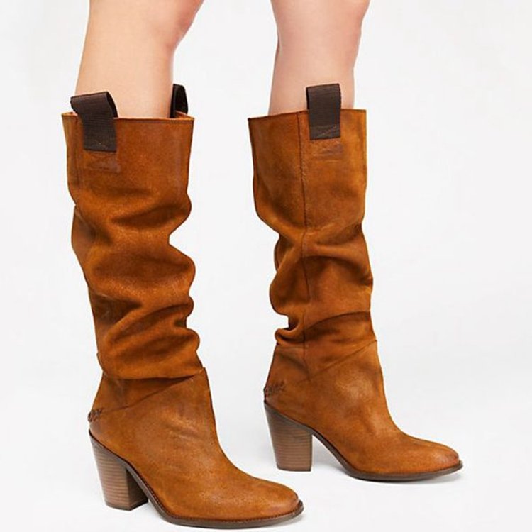 Brown knee-high boots with block heels on a white background