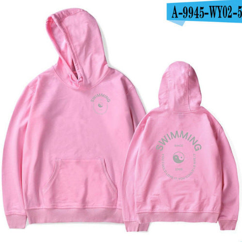 Pink hoodie with 'Swimming' text on front and back, on a white background.