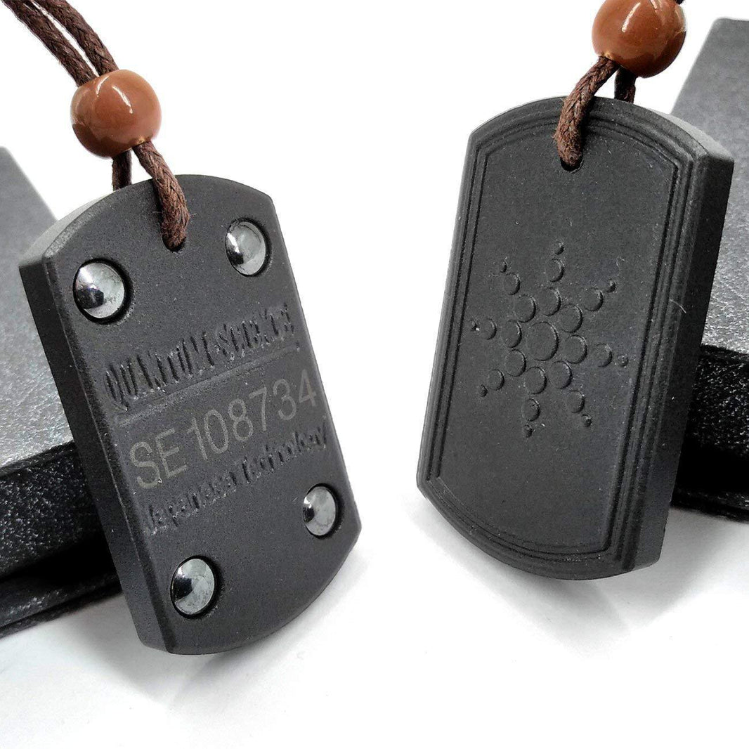 Black dog tags with star engraving and visible serial number on a white background