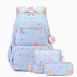 A pastel blue backpack set with matching pouches, featuring a colorful polka dot pattern in pink, orange, and purple, with a pink heart-shaped charm that reads 'Bachelorette Girl'.