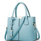 Light blue handbag with a strap on a white background