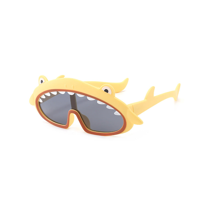 Shark-shaped sunglasses with yellow frame and gray lenses on a white background