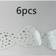 Set of six butterfly-patterned eye stickers on a gray background