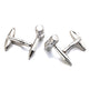 Silver gavel cufflinks on a white background