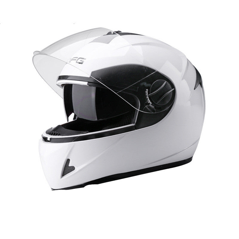A white full-face motorcycle helmet with a clear visor, shown from a three-quarters angle on a solid white background.