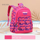 Pink and blue checkered backpack with 'zmbaby happy' branding on a beige background.