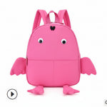 Pink backpack designed like a frog on a white background