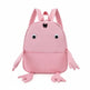 Pink backpack designed like a cartoon character with googly eyes and arms on a white background