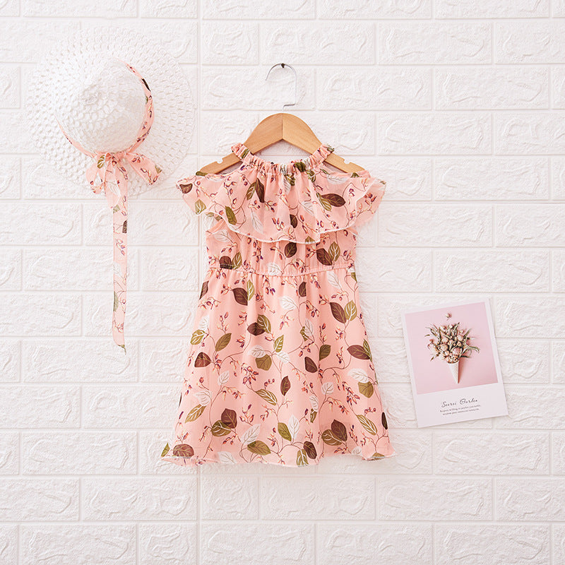 Pink floral dress with matching headband on a textured white background