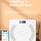 A white smart Bluetooth body fat scale sits on a wooden table next to a smartphone displaying its companion app, with promotional text above on a warm beige background.