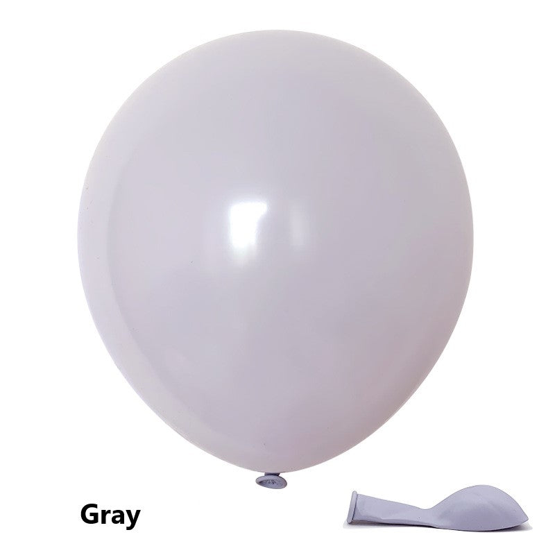 Gray balloon with a small deflated balloon attached on a white background
