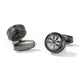 Black cufflinks with intricate design on a white background