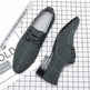 Pair of gray checkered shoes on a grid background