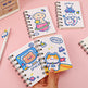 Three small spiral-bound notebooks with space-themed illustrations on a pink background