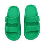 Green sandals with double straps on a white background