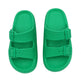 Green sandals with double straps on a white background