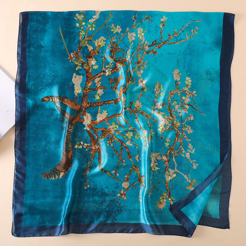Silk scarf with floral design on a blue background