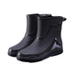 Pair of black rubber boots on a white background