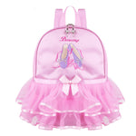 Pink backpack with ballet design and 'Dancing' text on a white background