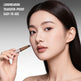 Woman applying makeup with a brush, text indicating product features.