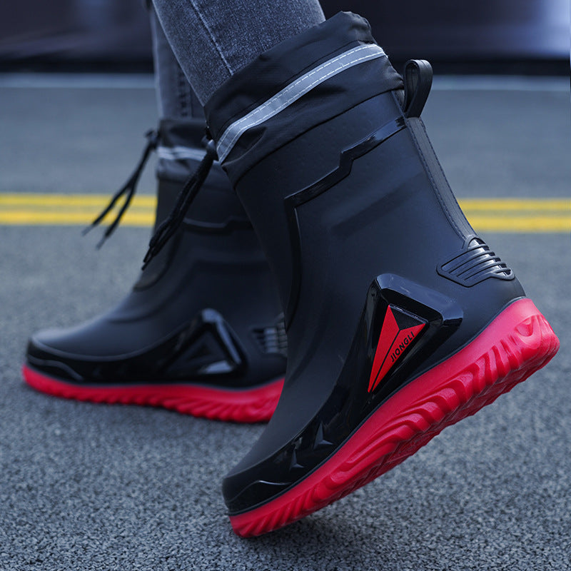 Black and red shoes on a road surface