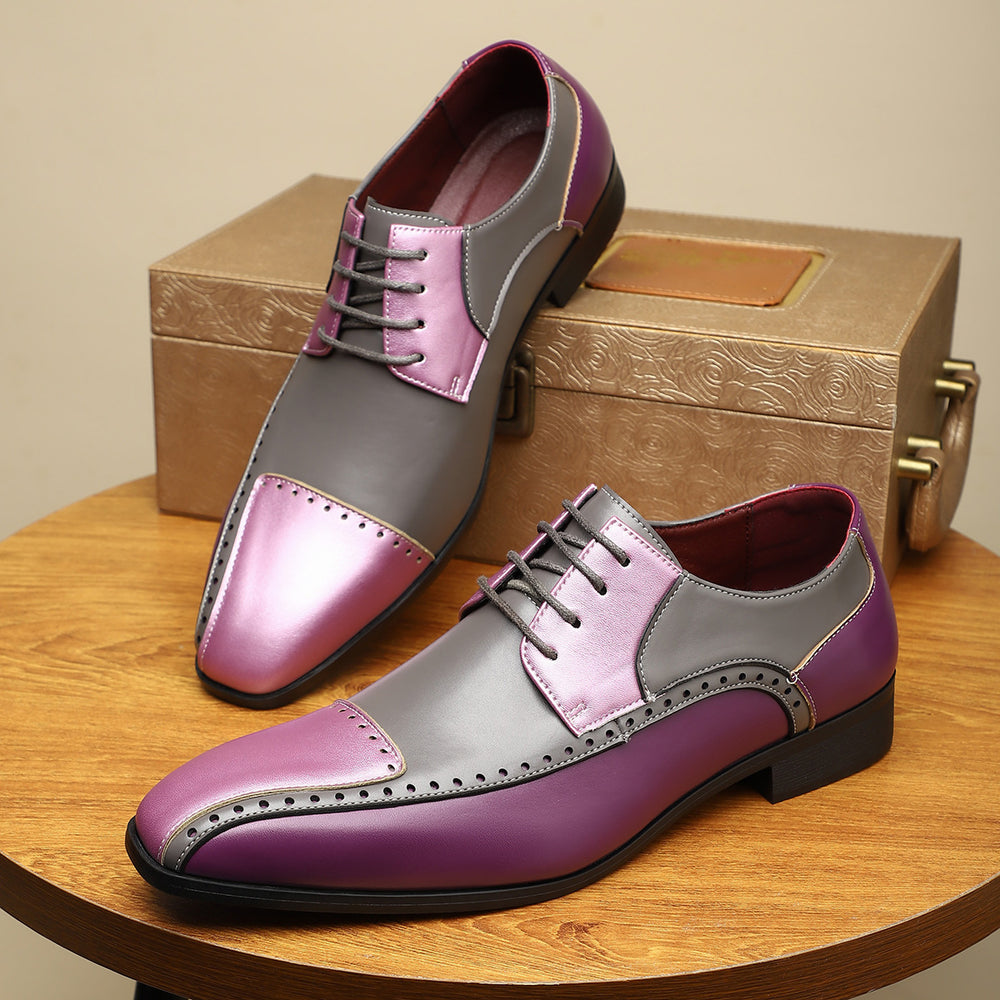 Purple and gray dress shoes on a wooden table with a gold box in the background.