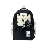 Black and white backpack with decorative elements on a white background