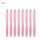 Set of 10 pink plastic knives on a white background