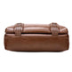 Brown leather clutch bag with perforated details on a white background