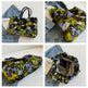 Collage of a colorful fur handbag with denim jeans in the background