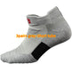 Gray ankle sock with a black patch and red logo on a white background