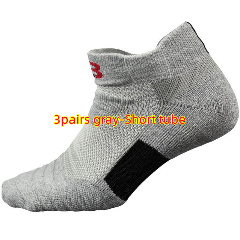 Gray ankle sock with a black patch and red logo on a white background