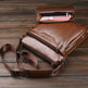Brown leather bag with a smaller pouch on a wooden surface