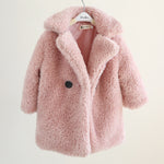 Pink fluffy coat on a hanger against a white background